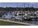 Picturesque marina with numerous boats docked and waterfront buildings in the background at 4290 Pinehurst Circle # B6, Little River, SC 29566