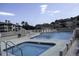 Relaxing pool area with lounge chairs and clear blue water next to several condos and apartment buildings at 4290 Pinehurst Circle # B6, Little River, SC 29566
