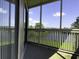 Enclosed porch overlooking a lake, providing a serene and private outdoor space at 4290 Pinehurst Circle # B6, Little River, SC 29566