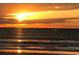 Vibrant sunset over the ocean, with the sun reflecting on the water's surface at 4290 Pinehurst Circle # B6, Little River, SC 29566
