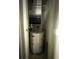 Utility closet containing an A.O. Smith water heater and HVAC system at 4290 Pinehurst Circle # B6, Little River, SC 29566