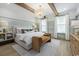 Serene main bedroom featuring wood beams, decorative lighting, two windows, and hardwood floors at 512 9Th Ave. S, North Myrtle Beach, SC 29582