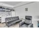 Cozy living area with a sleeper sofa, armchair, and small kitchen at 1207 S Ocean Blvd. # 20604, Myrtle Beach, SC 29577