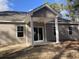 Covered back porch with white columns and ceiling fan. Sliding glass door for easy access at 1581 Highway 701 South, Loris, SC 29569