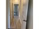 Hallway with hardwood floors and white trim leading to various rooms at 1581 Highway 701 South, Loris, SC 29569