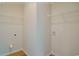 Bright laundry room with wire shelving and hookups for a washer and dryer at 1581 Highway 701 South, Loris, SC 29569