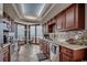 Well-equipped kitchen with dark cabinetry, stone countertops and ocean views at 9650 Shore Dr. # 1805, Myrtle Beach, SC 29572