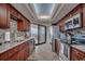 Bright kitchen featuring stainless steel appliances, granite countertops, and balcony access at 9650 Shore Dr. # 1805, Myrtle Beach, SC 29572