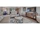 Living room with plush seating, decorative accents, and a modern entertainment center at 9650 Shore Dr. # 1805, Myrtle Beach, SC 29572