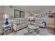 Living room with neutral tones, comfortable seating and a view of the dining area at 9650 Shore Dr. # 1805, Myrtle Beach, SC 29572