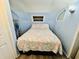 Cozy bedroom featuring a double bed with patterned quilt and storage at 6001 - N21 S Kings Hwy., Myrtle Beach, SC 29575