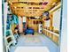 Spacious garage with ample storage, including shelves, cabinets, and room for a bicycle and other items at 6001 - N21 S Kings Hwy., Myrtle Beach, SC 29575