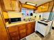 Well-equipped kitchen with wood cabinetry, countertops, and a view into the bedroom at 6001 - N21 S Kings Hwy., Myrtle Beach, SC 29575