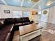 Inviting living room with a stylish leather sofa, wood floors, and lots of natural light at 6001 - N21 S Kings Hwy., Myrtle Beach, SC 29575