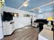 Bright living room features stylish decor, hardwood floors, and plenty of natural light at 6001 - N21 S Kings Hwy., Myrtle Beach, SC 29575