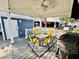 Inviting outdoor patio with a table, chairs, grill, overhead fan, and stylish lighting for relaxing and entertaining at 6001 - N21 S Kings Hwy., Myrtle Beach, SC 29575