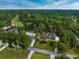 An aerial view of a house by a golf course surrounded by towering trees at 3517 Golf Ave., Little River, SC 29566