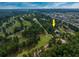 Overhead view of home on golf course with lush greenery and community at 3517 Golf Ave., Little River, SC 29566
