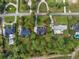 Aerial view of a home with a spacious lot surrounded by lush greenery at 3517 Golf Ave., Little River, SC 29566