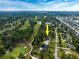 Expansive aerial view of home on golf course with mature trees and community at 3517 Golf Ave., Little River, SC 29566
