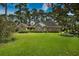 Charming single story brick home with dormer windows and a well-manicured lawn at 3517 Golf Ave., Little River, SC 29566