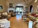 Inviting living room with a fireplace, vaulted ceiling, and french doors to the porch at 3517 Golf Ave., Little River, SC 29566