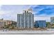 Beachfront condo building featuring multiple floors with private balconies and ocean views at 1207 S Ocean Blvd. # 20304, Myrtle Beach, SC 29577