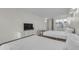 Bright bedroom features two beds, a dresser with TV, a table and chairs, and a compact, efficient kitchen at 1207 S Ocean Blvd. # 20308, Myrtle Beach, SC 29577