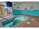 Indoor hot tub with brick surround and view of the parking area and blue sky at 1207 S Ocean Blvd. # 20308, Myrtle Beach, SC 29577