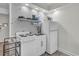 Efficient kitchen features essential appliances, marble-style backsplash, open shelving, and ample countertop space at 1207 S Ocean Blvd. # 20308, Myrtle Beach, SC 29577