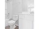 Bright bathroom featuring a shower-tub combo and white vanity at 1209 Nw Calabash Station Blvd., Calabash, NC 28467