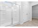 Bathroom showcasing glass shower and tile floor next to a closet at 1209 Nw Calabash Station Blvd., Calabash, NC 28467