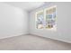 Light-filled bedroom featuring plush carpet and ample natural light at 1209 Nw Calabash Station Blvd., Calabash, NC 28467