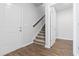 Hallway with a staircase and hardwood floors at 1209 Nw Calabash Station Blvd., Calabash, NC 28467