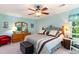 Spacious bedroom features a ceiling fan and large window at 4390 Daphne Ln. # H, Murrells Inlet, SC 29576