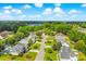 Beautiful aerial view of a neighborhood featuring lush landscaping, mature trees, and well-maintained homes under a blue sky at 629 Slash Pine Ct., Myrtle Beach, SC 29579