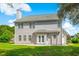 Back exterior view of a home with a well-manicured lawn and patio at 629 Slash Pine Ct., Myrtle Beach, SC 29579