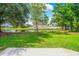 Backyard view of a house with a pond and white picket fence at 629 Slash Pine Ct., Myrtle Beach, SC 29579