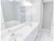 Modern bathroom with double vanity, large mirror, soaking tub, and a separate shower at 629 Slash Pine Ct., Myrtle Beach, SC 29579