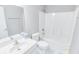 Clean bathroom with a single vanity, toilet, and a shower-tub combination with white tile at 629 Slash Pine Ct., Myrtle Beach, SC 29579