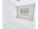 Bright bedroom with plush carpeting, neutral walls, and a large window with blinds overlooking the yard at 629 Slash Pine Ct., Myrtle Beach, SC 29579