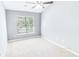 Neutral bedroom with carpet flooring, fan, and a large window with blinds at 629 Slash Pine Ct., Myrtle Beach, SC 29579