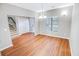Open dining area with hardwood floors, a modern chandelier, and a staircase leading to the upper level at 629 Slash Pine Ct., Myrtle Beach, SC 29579