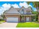 Beautiful two-story home with a brick and siding exterior, a two-car garage, and a well-maintained front lawn at 629 Slash Pine Ct., Myrtle Beach, SC 29579