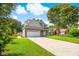 Charming two-story home featuring a brick and siding facade, a two-car garage, and a well-manicured lawn at 629 Slash Pine Ct., Myrtle Beach, SC 29579