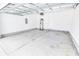 Spacious garage with concrete flooring, white walls, water heater, and an electrical panel at 629 Slash Pine Ct., Myrtle Beach, SC 29579