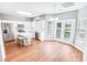 Bright kitchen with white cabinets, stainless steel appliances, an island with seating, and wood-look floors at 629 Slash Pine Ct., Myrtle Beach, SC 29579