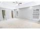 Large primary bedroom featuring plush carpeting, a tray ceiling with accent lighting, and plentiful natural light at 629 Slash Pine Ct., Myrtle Beach, SC 29579