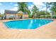 Large community pool with lounge chairs and umbrellas perfect for a relaxing day of swimming and sunbathing at 629 Slash Pine Ct., Myrtle Beach, SC 29579
