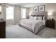 Serene bedroom with neutral decor, large windows, and a comfortable bed with luxurious bedding at 1055 Oak Meadow Dr., Conway, SC 29526